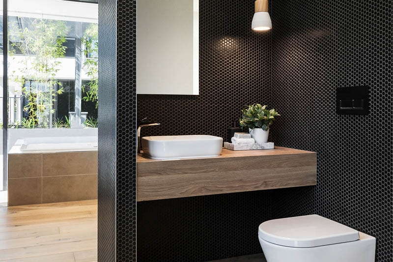 Dark and bold colours in a powder room design by Henley Homes